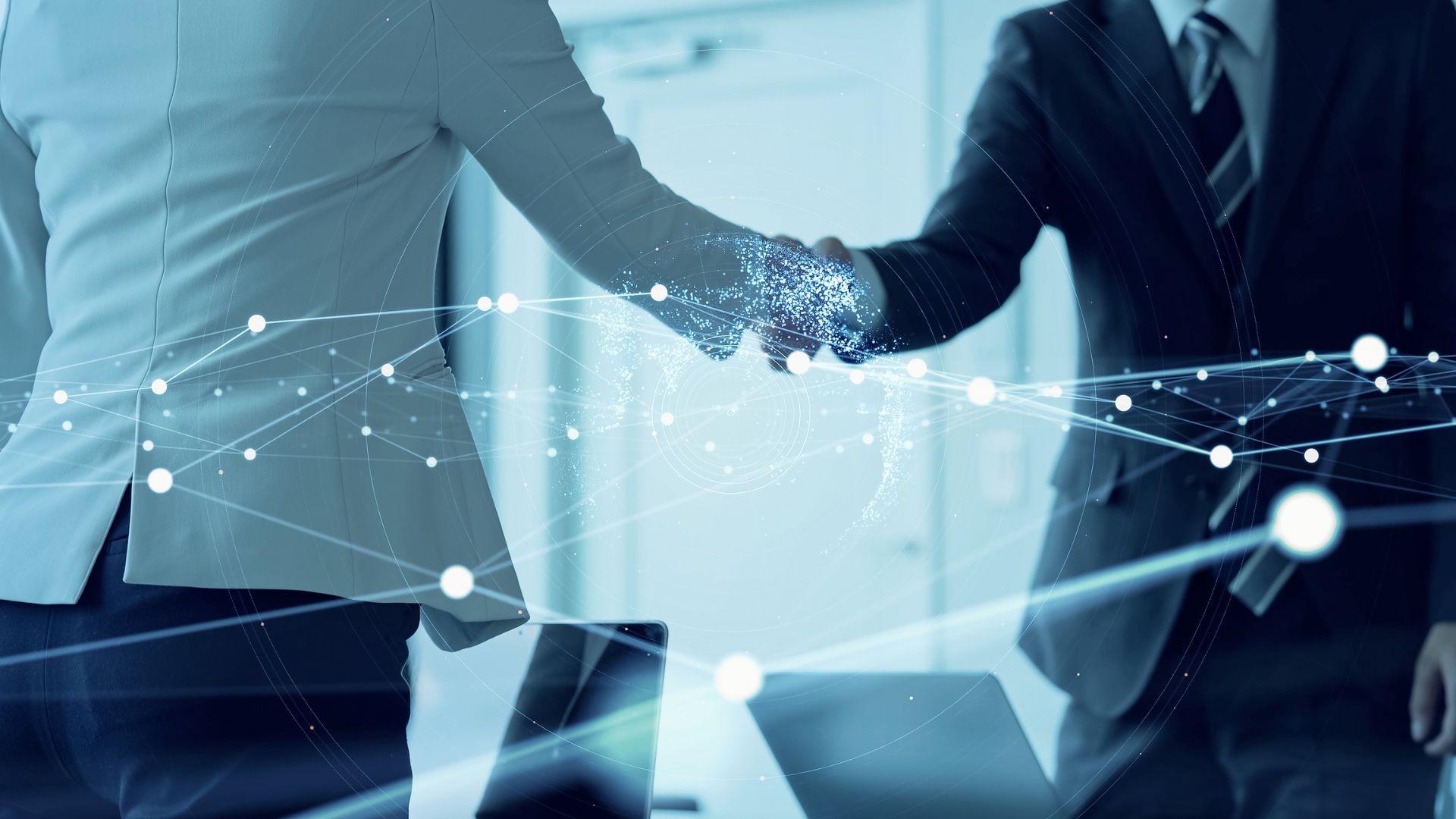 two people shake hands